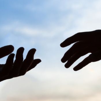 hands reaching out to each other